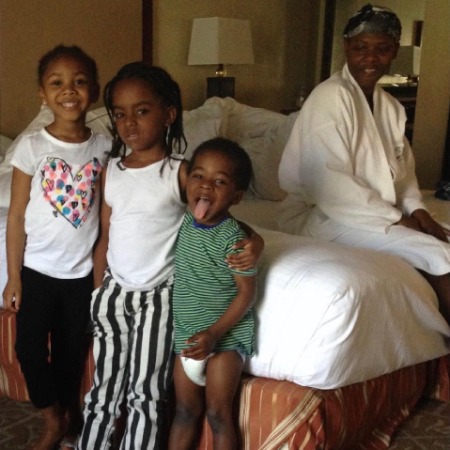 The picture of Lauryn Hill with three of her kids. 